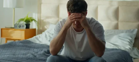 Man Sitting, Holding Head,Feeling Depressed